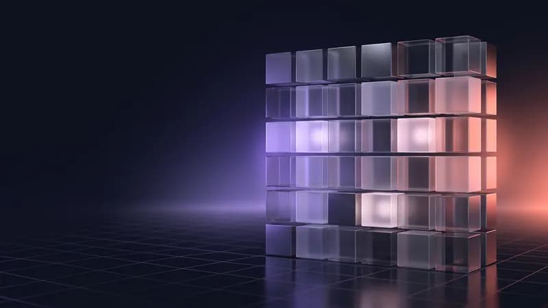 Grelha de cubos de vidro, alguns iluminados, como um calendário.